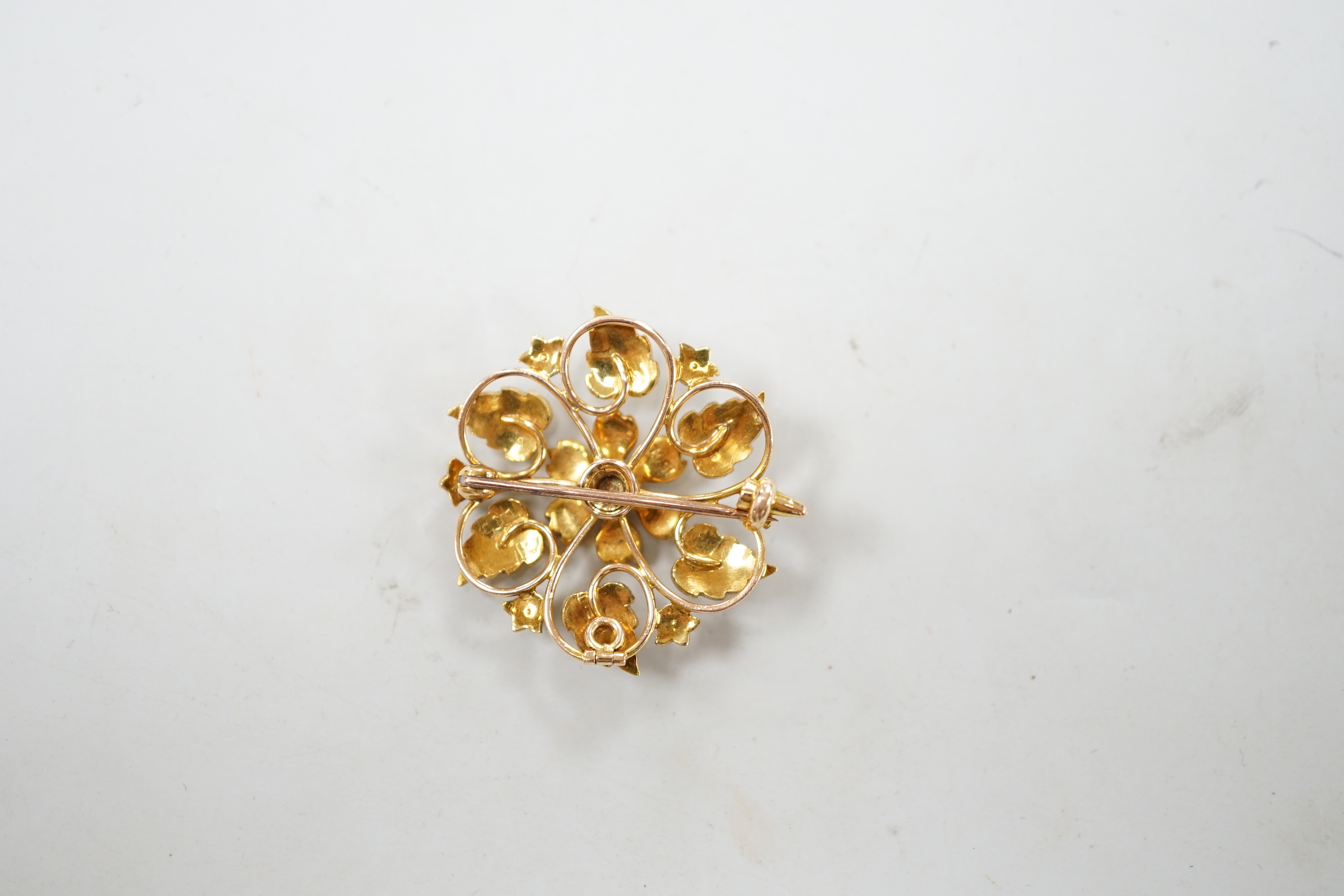 An Edwardian 15ct and seed pearl cluster set flower head brooch, 28mm, gross weight 6.3 grams.